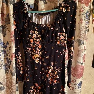 Black mini dress with floral design with long sleeves but very cool